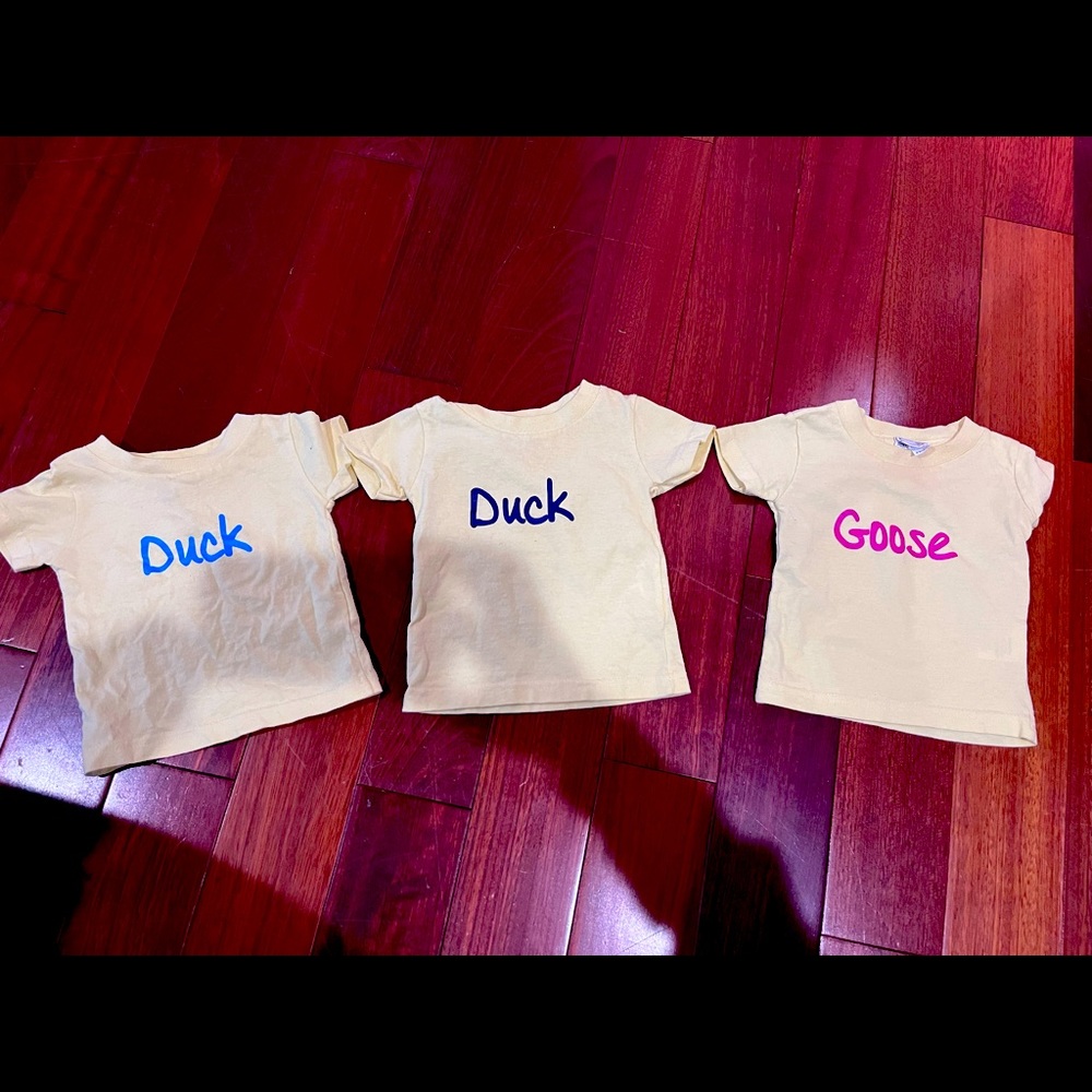 T shirts “duck” “duck” “goose”